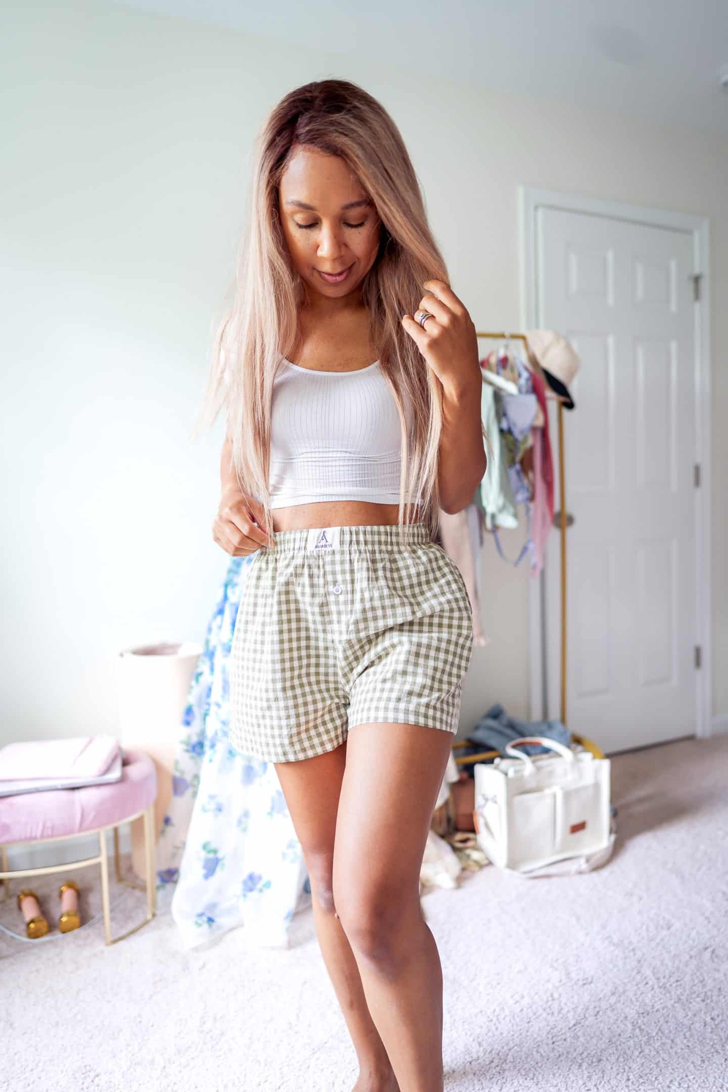A close-up of stylish gingham boxer shorts, a key piece for mom friendly fashion in the summer.
