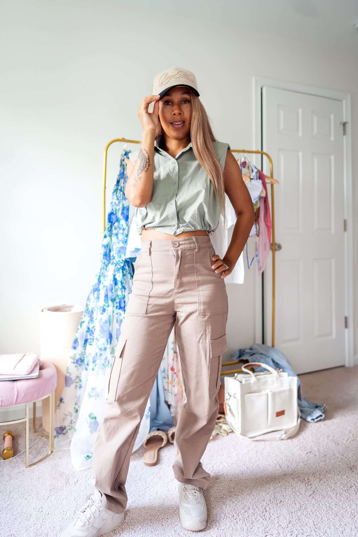 A mom looking stylish in high-waisted, baggy cargo pants, a trendy piece for casual summer outfits.